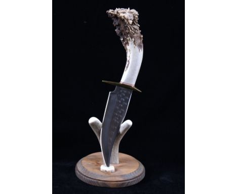 Included in this lot we have a antler handle bowie knife with a lion head hand carved pommel with display stand. The knife di