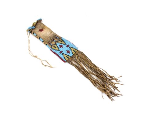 Offered for sale in this lot is an outstanding third-quarter 19th Century Lakota Sioux Native American Indian beaded pipe bag