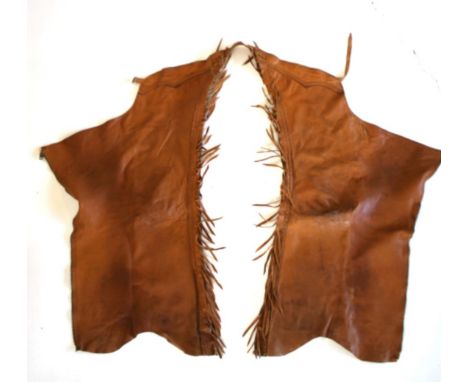 Included in this lot we have a pair of western Gerald Roberts Chap-Panel leather chaps. The first pair of chaps display light
