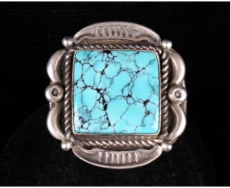 Offered in this lot is a large Navajo native american sterling silver ring with No.8 Turquoise, signed by the artist Randall 