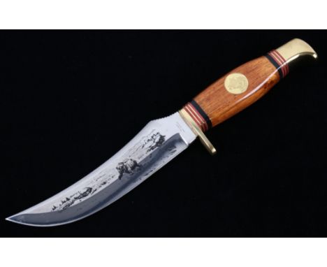 Featured in this lot we have a Solingen German bear etched hunting skinner style buck knife with sheath. The  knife displays 