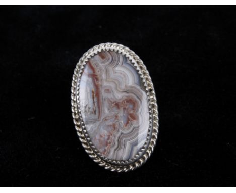 Included in this lot is a singed Navajo Native American Mae Bia Lace Agate and sterling silver ring. The piece shows a large 