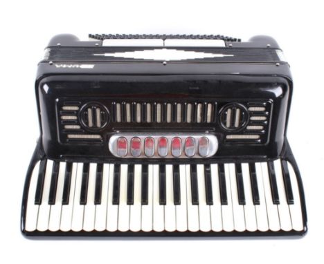 Featured in this lot we have a Duma piano accordion with carry case originating from the late 1900's. The accordion displays 