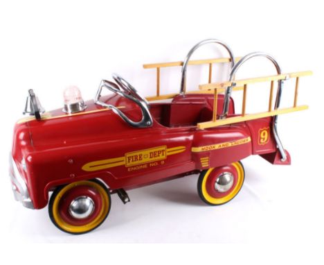 Included in this lot we have a Fire Dept No 9 Hook and Ladder metal pedal car originating from the 1950's. The piece shows st