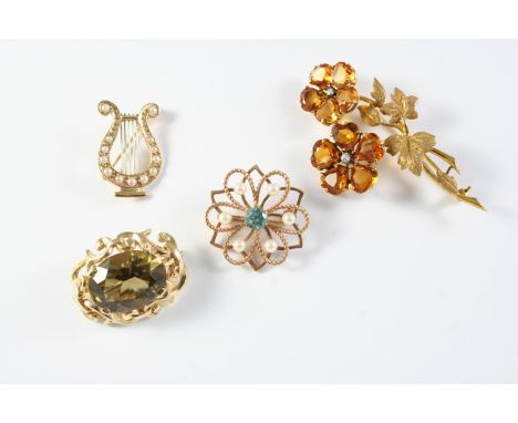 A GOLD AND CULTURED PEARL LYRE BROOCH mounted with graduated half cultured pearls in 9ct gold, 3cm long, a zircon, cultured p