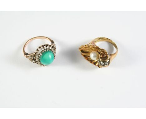 A TURQUOISE AND DIAMOND CLUSTER RING the oval-shaped turquoise cabochon is set within a surround of rose-cut diamonds, in gol