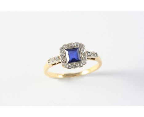 A SAPPHIRE AND DIAMOND CLUSTER RING the square-shaped sapphire is set within a surround of single-cut diamonds, with further 