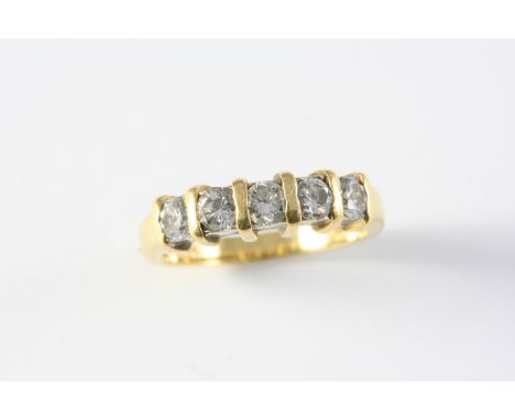 A DIAMOND HALF HOOP RING set with five circular-cut diamonds, in 18ct gold. Size R