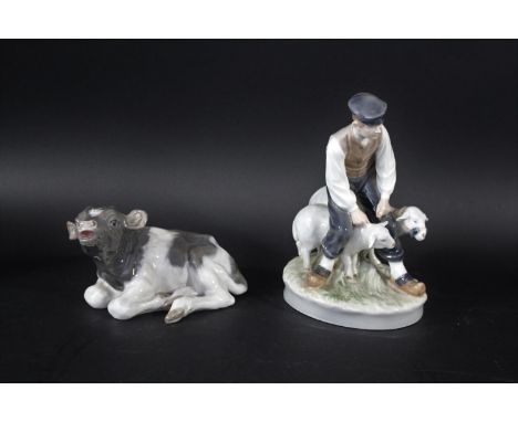 ROYAL COPENHAGEN including Model No 1072 Calf Recumbent, and 627 Farmer with two Sheep. Farmer 19.5cms high. (2)