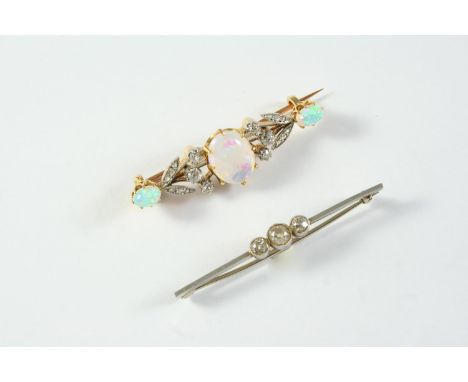 AN OPAL AND DIAMOND BROOCH the central oval-shaped solid white opal is set within a foliate design of rose-cut and circular-c
