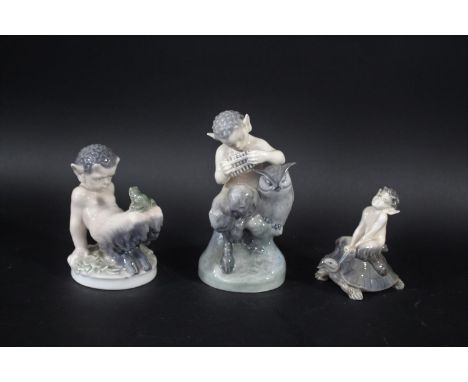 ROYAL COPENHAGEN including Model No 2107 Faun with Owl, 1713 Faun with Frog on knees, and 858 Faun on Tortoise. (3)