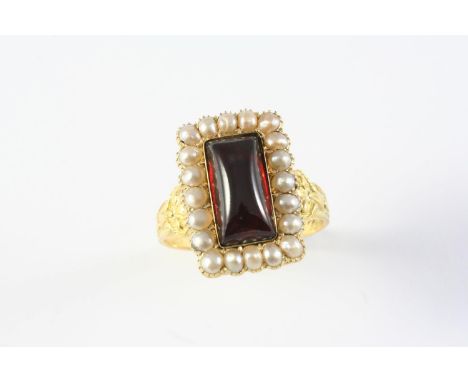 AN ANTIQUE GARNET AND PEARL CLUSTER RING the rectangular cabochon garnet is set within a surround of half pearls, with applie