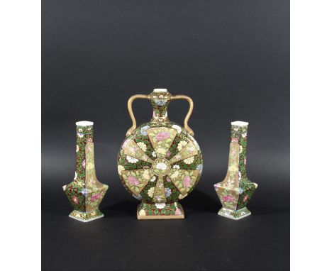 FISCHER BUDAPEST - GARNITURE OF VASES including a moon flask shaped vase with gilt handles, painted with a variety of flowers