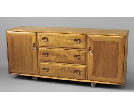 ERCOL SIDEBOARD a large light elm sideboard with 3 central drawers (1 for cutlery) and flanked by 2 cupboards with single she
