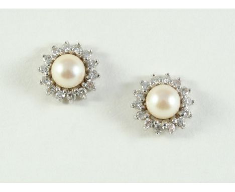 A PAIR OF CULTURED PEARL AND DIAMOND STUD EARRINGS each set with a cultured pearl measuring approximately 7.2mm within a surr