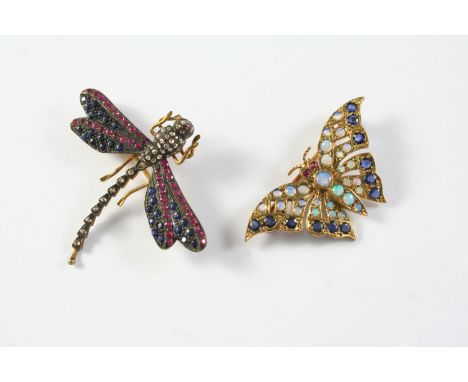 A GEM SET AND GOLD BUTTERFLY BROOCH mounted with circular-cut opals and sapphires, with ruby eyes, in gold, 4cm wide, togethe