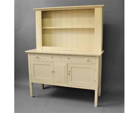 HEAL &amp; SON - ARTS &amp; CRAFTS DRESSER designed by Sir Ambrose Heal (1872-1959), probably made in oak the overhanging cor