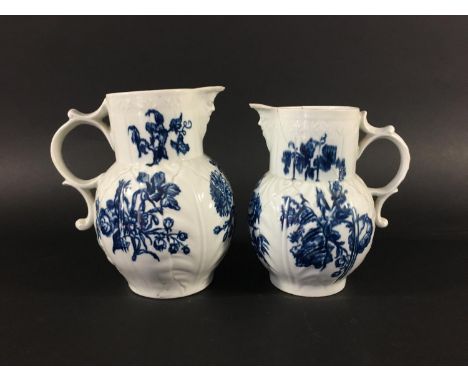TWO WORCESTER JUGS circa 1760-70, blue printed in the Natural Sprays pattern, hatched crescent marks, heights 19 and 18cm (2)