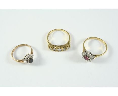 A DIAMOND FIVE STONE RING the five graduated circular-cut diamonds are set in 18ct gold, size P 1/2, together with a ruby and
