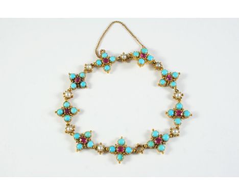 A TURQUOISE, RUBY AND PEARL BRACELET formed with nine quatrefoil clusters each centred with a circular-cut ruby and four turq