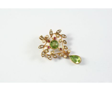 AN EDWARDIAN PERIDOT, RUBY AND PEARL BROOCH PENDANT centred with a circular-cut peridot within an openwork foliate gold surro