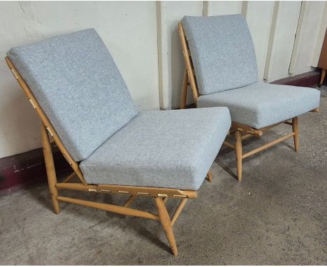 A pair of Ercol Blonde beech 427 model easy chairs 