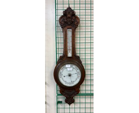 An early 20th Century oak aneroid barometer 