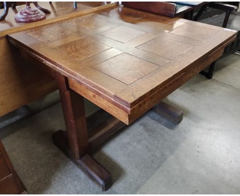An Art Deco oak drawer leaf table 