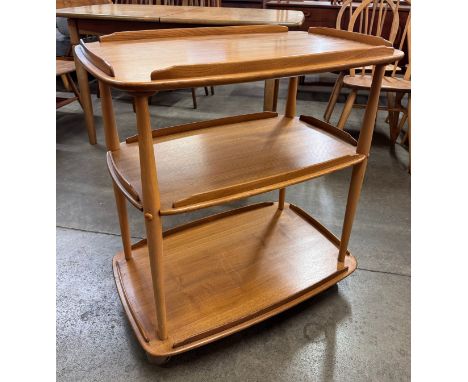 An Ercol Blonde elm and beech Windsor trolley 