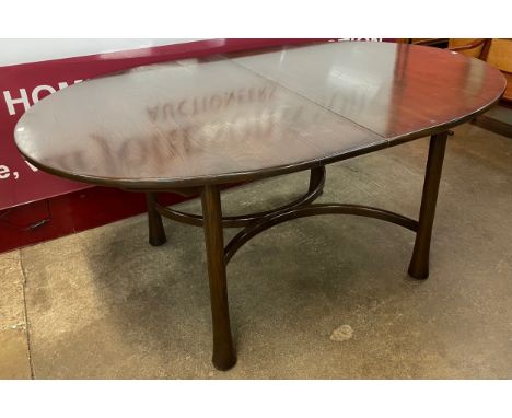 An Ercol Golden Dawn ash extending Saville dining table 