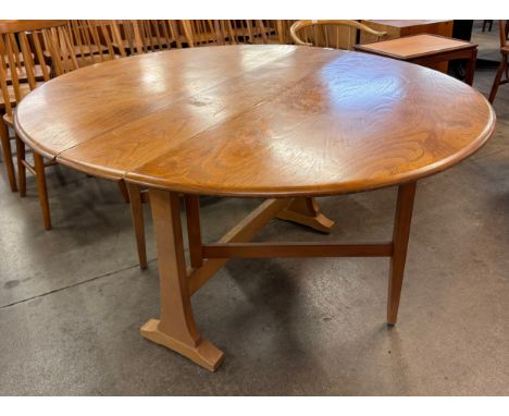 An Ercol elm and beech Windsor dropleaf table 