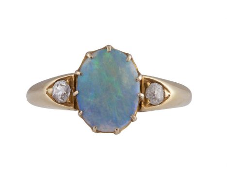 AN OPAL AND DIAMOND RINGThe oval-shaped opal centre with old brilliant-cut diamond shoulders, mounted in 18K gold, diamonds a