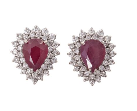 A PAIR OF RUBY AND DIAMOND EARRINGSEach set with a pear-shaped ruby within a double-tiered surround of graduated round brilli
