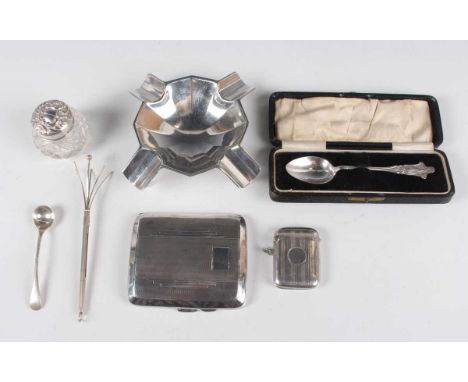 A George V silver curved rectangular engine turned cigarette case, Birmingham 1933 by M.H. Meyer Ltd, length 8.5cm, and a sma