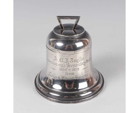 A George V silver inkwell in the form of a bell with hinged lid and angular handle above an engraved inscription, Birmingham 