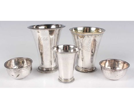 A group of three mid-18th century Swedish silver beakers, each of flared tapering cylindrical form, on a reeded circular foot