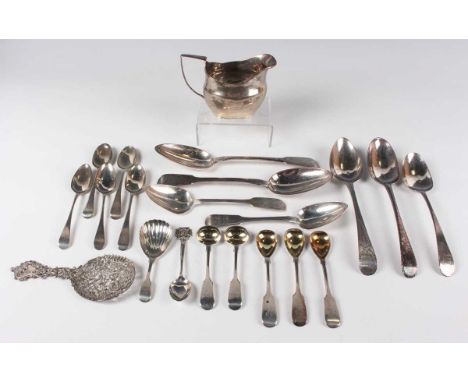 A George III silver oval cushion shaped cream jug, height 8cm, together with a small collection of silver cutlery, including 