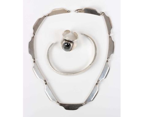 Three pieces of Danish silver jewellery, each designed by Bent Knudsen, comprising a ring, mounted with an oval cabochon hema