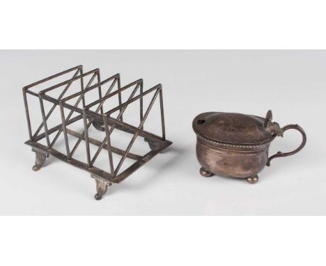 An Edwardian silver four-division toast rack on scroll feet, London 1903 by William Hutton &amp; Sons Ltd, length 12.5cm (lac