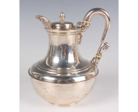 A Victorian silver hot water jug with hinged lid and acorn finial, flanked by an anthemion moulded spout and snake's head scr