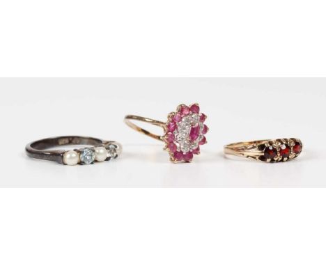 A 9ct gold, ruby and diamond oval cluster ring, import mark London 1989, ring size approx P, a 9ct gold and garnet three ston