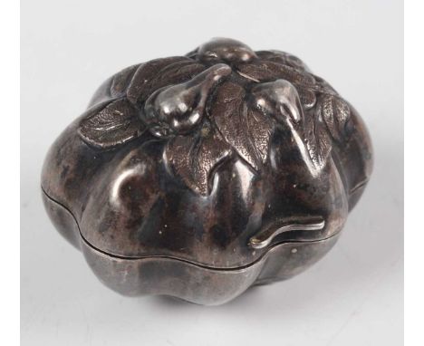 A rare Victorian silver novelty nutmeg grater in the form of a nut kernel, the hinged lid and underside repoussé decorated wi