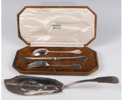 A George V silver trefid pattern christening knife, fork and spoon set, London 1924 by Harrods Ltd, cased, and a George III s