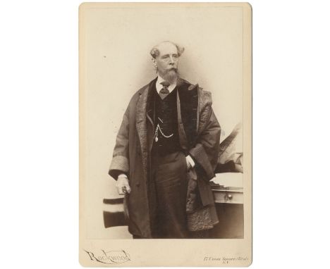 DICKENS (CHARLES)ROCKWOOD (GEORGE GARDNER) Three quarter length cabinet portrait of Charles Dickens,  albumen print, mounted,