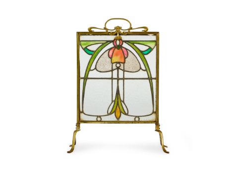 ENGLISH FIRESCREEN, CIRCA 1900 brass, with stained and leaded glass panel(44cm wide, 71cm high)