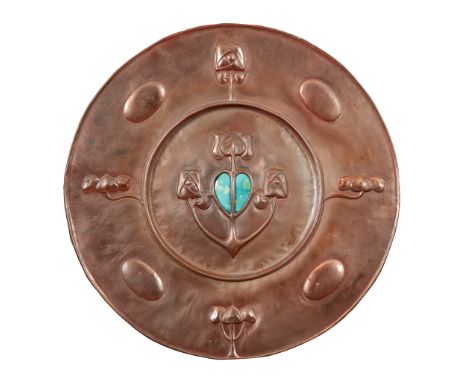 MANNER OF W. J. NEATBY ARTS &amp; CRAFTS COPPER AND ENAMEL WALL CHARGER, CIRCA 1900 the central embossed stylised floral moti