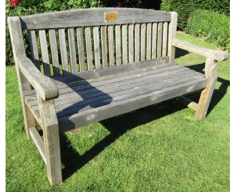 A weathered pine garden bench with slatted seat and back, 155cm long