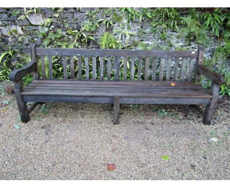 A good quality teak garden bench, 240cm long approx 
