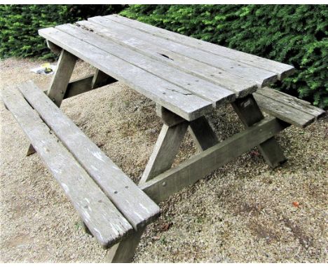 A weathered teak picnic bench, 152cm long 