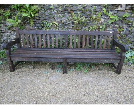 A good quality teak garden bench, 240cm long approx 